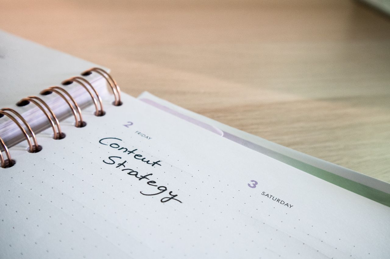 Close-up view of a notebook page displaying 'Content Strategy', well suited for business planning visuals.